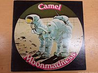 Front cover of the Camel Moonmadness LP record showing astronaut camel artwork.