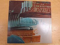 Front view of 'Miles of Aisles' vinyl LP album cover showing abstract auditorium design and album title with visible wear on cover.