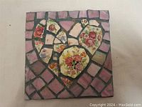 Full view of 6-inch square mosaic artwork showing heart motif composed of broken crockery pieces and pink tile background.
