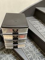 4-drawer plastic organizer with labeled drawers 'Tacky Stuff,' 'Chalk Pads,' and 'Display Stickers.'