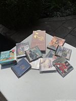 Wide view of the DVDs, CDs and the Barbra Streisand DVD box set on a table outdoors