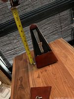 Photo of the metronome measured for height approximately 7.5 inches.