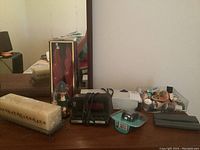 Photo of the entire lot showing all included items against wall with mirror reflection