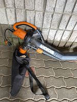 Side view of Worx electric leaf blower including handle, air tube, and attached black collection bag with strap.