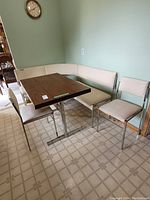 Overall view of table, corner bench and two chairs