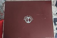Arthur Court branded burgundy box with white logo