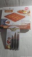 Large box of CopperChef Bacon Crisper designed to cook 12 slices of bacon with non-stick coating.