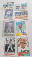 Multiple vintage Topps baseball cards arranged to show individual player images and some stats. Cards include Mike Schmidt, Reggie Smith, and others.