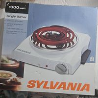 Box of the Sylvania 1000 watt single burner with product image and branding.
