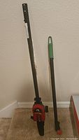 Photo of full pole saw attachment and extension pole showing condition and handles