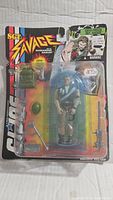 Front view of Sgt. Savage figure in original blister packaging showing figure and accessories.