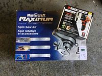 Mastercraft Maximum Spin Saw Kit box with Black & Decker Lithium Cordless saw box on top