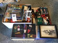 Box of mixed loose and carded vehicles, tray and helicopter visible
