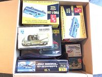 Overhead box view showing multiple kits including Ford Pickup and aircraft kit beneath