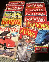 Overview photo showing 13 Dune Buggy and Hot VWs magazines stacked with colorful covers