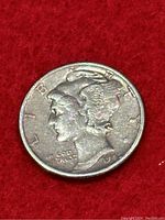 Obverse side of a 1945 Mercury silver dime showing Liberty's profile with visible circulation wear.