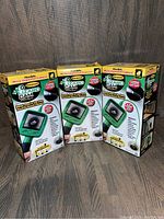 Three boxed Lizard Cam Flexible Micro-Inspection Cameras with waterproof design, each featuring a 2.4-inch color LCD screen and a 4-foot flexible cable.