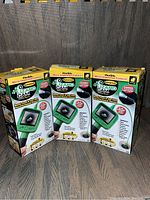 Photo showing three boxed Lizard Cam micro-inspection cameras with flexible cables and color LCD screens.