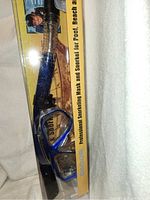 Snorkeling mask and snorkel in original packaging, blue and black color scheme, clear lens
