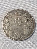 Reverse side showing crown over maple leaf wreath and denomination text.