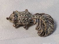 Close-up of the squirrel-shaped sterling silver marquisette pin brooch showing the detailed stones and tail design