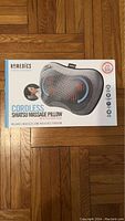 Photo of the boxed Homedics Cordless Shiatsu Massage Pillow showing front of packaging with product image, brand name, product description, and features.
