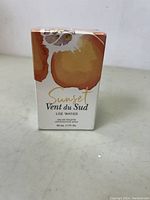 Box front with Sunset Vent du Sud Lise Watier label and floral watercolor design.