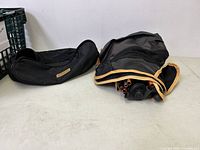 Folded camping chair components with carrying bag, showing compact and portable form.