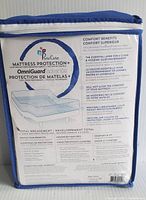 Photo showing the mattress protector packaging highlighting the Pure Care brand and OmniGuard Advance protection benefits.