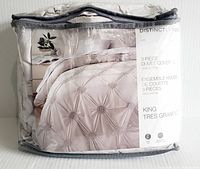 Packaged Distinctly Home 3 piece duvet cover set in clear zippered storage bag showing product picture and brand name.