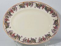 Full view of 11x14 inch oval platter with grapevine design around rim.