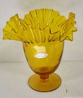 Front view showing the full vase with ruffled top and Blenko label.