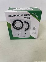 Two images of the BN-LINK BND-60/U47 mechanical timers in original packaging, displayed at different angles.