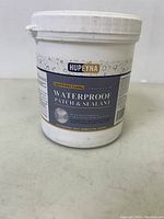 Front view of HUPEYNA 1kg waterproof patch and sealant bucket showing product name and label details
