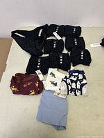 Lot of various new women's panties displayed on table, showing multiple patterns and colors.