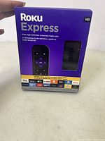 Front view of the Roku Express HD box showing the box design and contents depicted