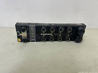 Front and top view of the Turck Ethernet IO module showing M12 sensor ports, status LEDs, and model label TBEN-L4-81OL.