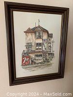 Front view of the framed hand-painted lithograph featuring 'Eddies Grocery Store' building with 7up and Pepsi signage clearly visible.