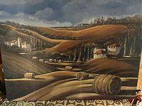 Front view of the original oil painting showing the landscape artwork with hay bales, hills, houses, and cloudy sky.