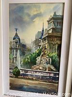 Front view of the framed watercolour painting depicting a cityscape of Madrid, including architectural details and statues.