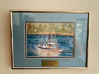 Framed watercolour painting titled 'Fish Boat Trawler' showing the full artwork with blue mat and plaque.