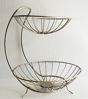 Front view of the stainless steel 2-tier fruit stand showing both upper and larger lower baskets with their wireframe construction.