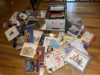 Overview of multiple books spread on floor including craft, children's and fiction books