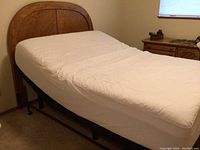 Assembled bed on frame with headboard