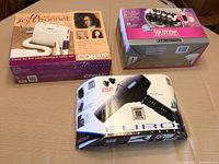 Conair Soft Bonnet, Remington roller set, and Conair Euro Pro hair dryer in boxes