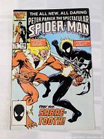 Front cover showing Spider-Man in black costume fighting Sabretooth, with comic details including issue number 116, price 75 cents, and Marvel Comics branding.
