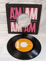 45 RPM vinyl record of David Bowie's Young Americans on Victor label, laying flat seen from above