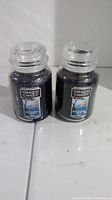 Front view of 2 Yankee Candle jars with visible Mediterranean Breeze labels and color of wax