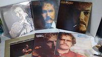 Six Gordon Lightfoot vinyl albums arranged in two rows, showing front covers with photos of the artist in varied poses and close-ups.
