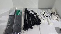 Overview of cable ties in different sizes and colors, loose and packaged